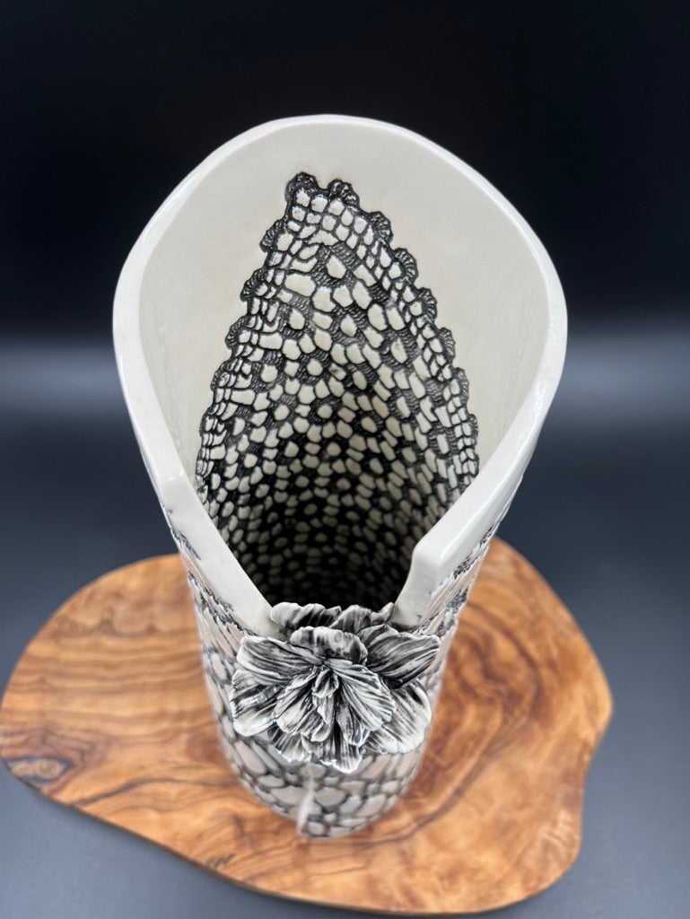 Black lace vase with flower at lip and black interior lace, tall