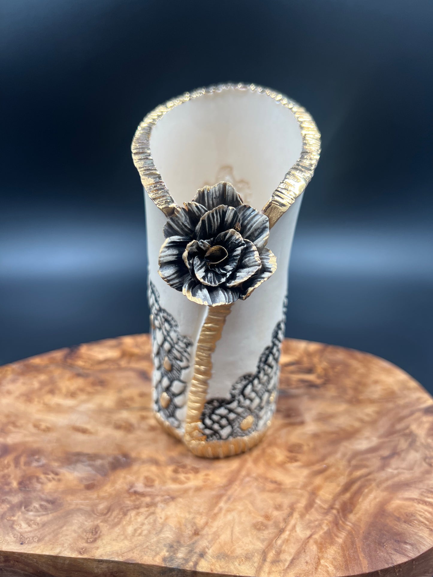 Mini black and gold vase with flower accent
