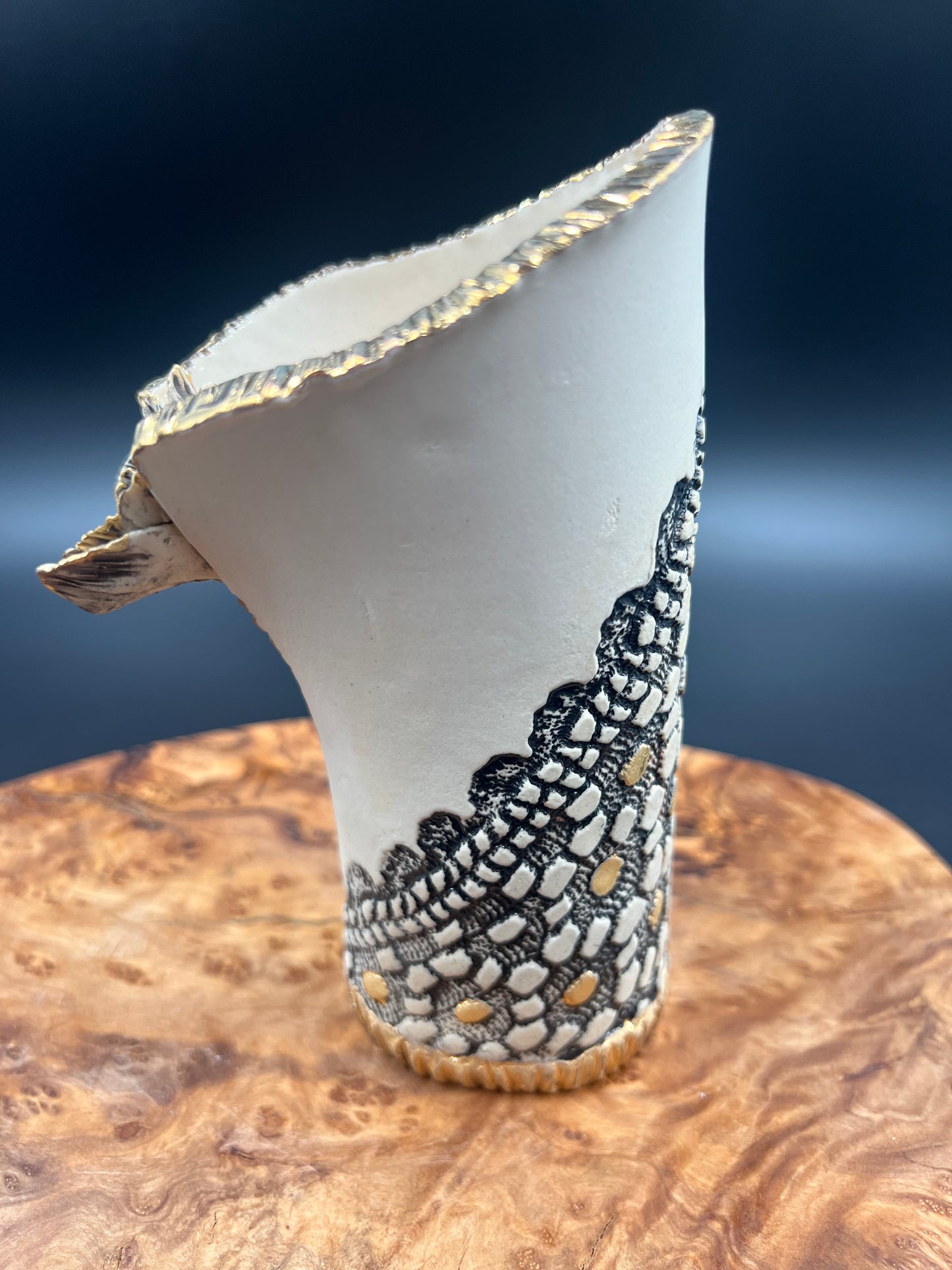 Mini black and gold vase with flower accent