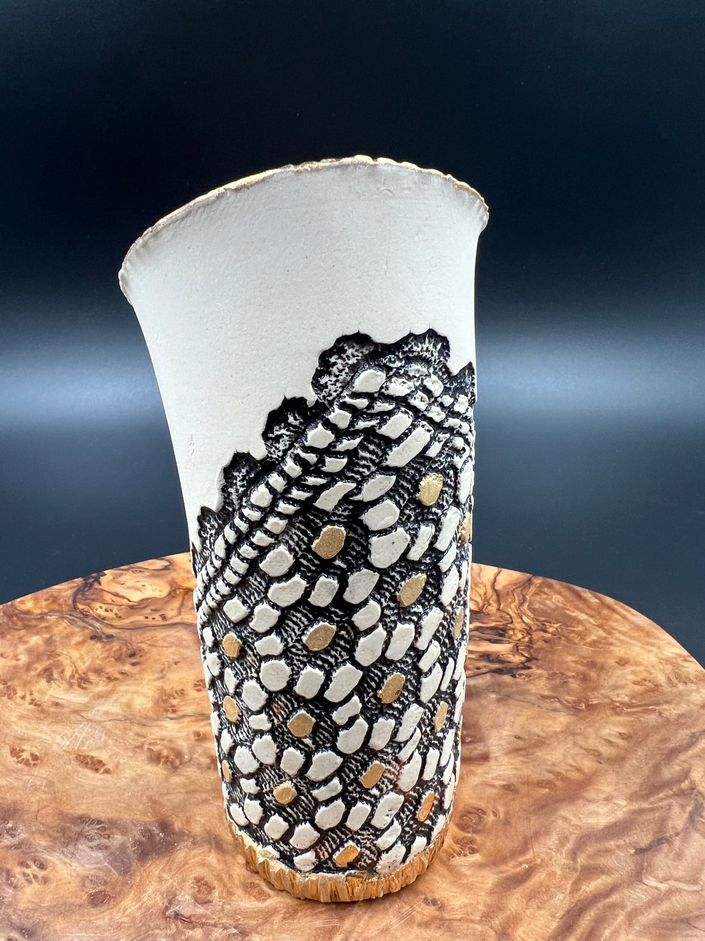 Mini black and gold vase with flower accent