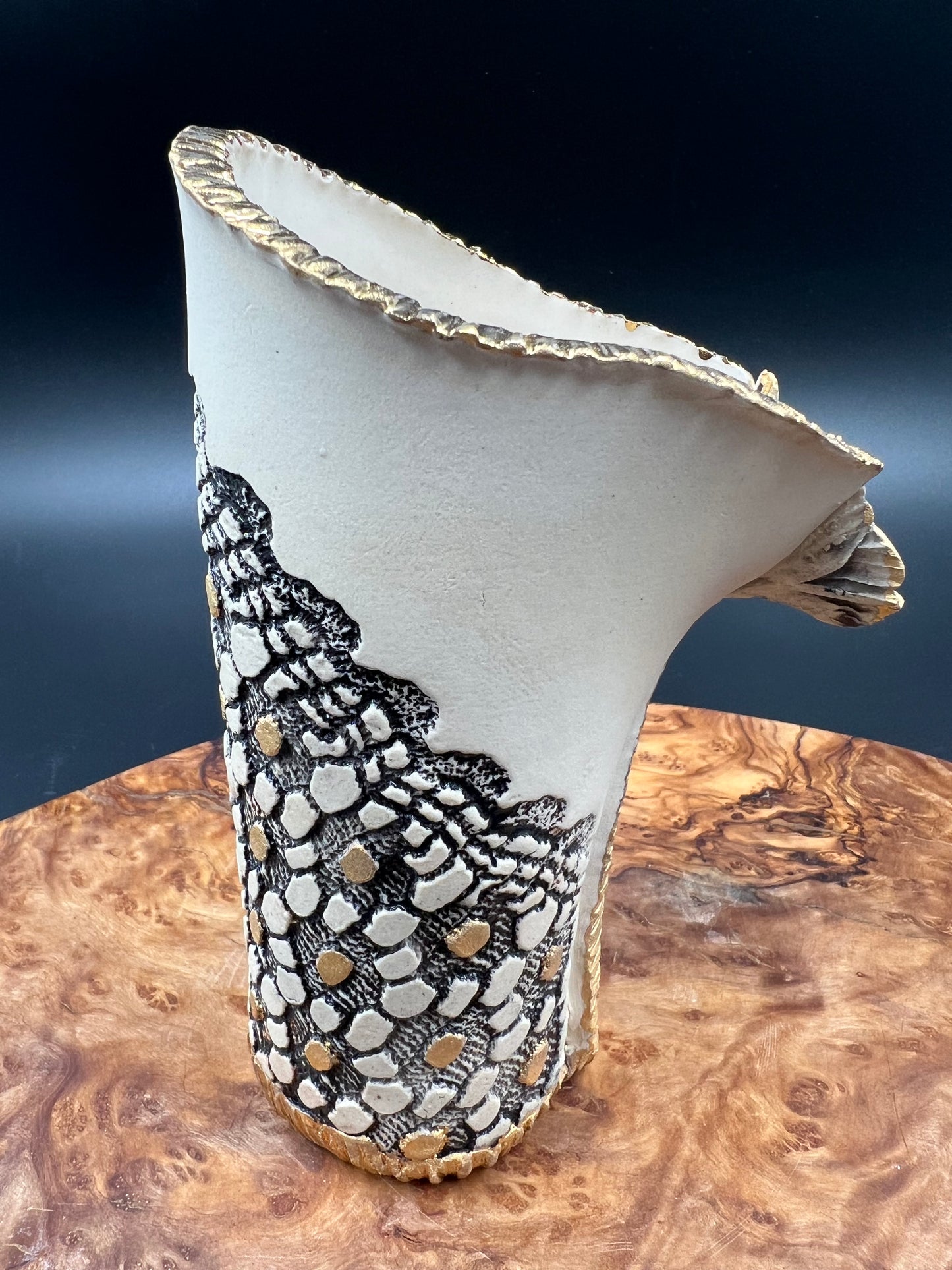 Mini black and gold vase with flower accent