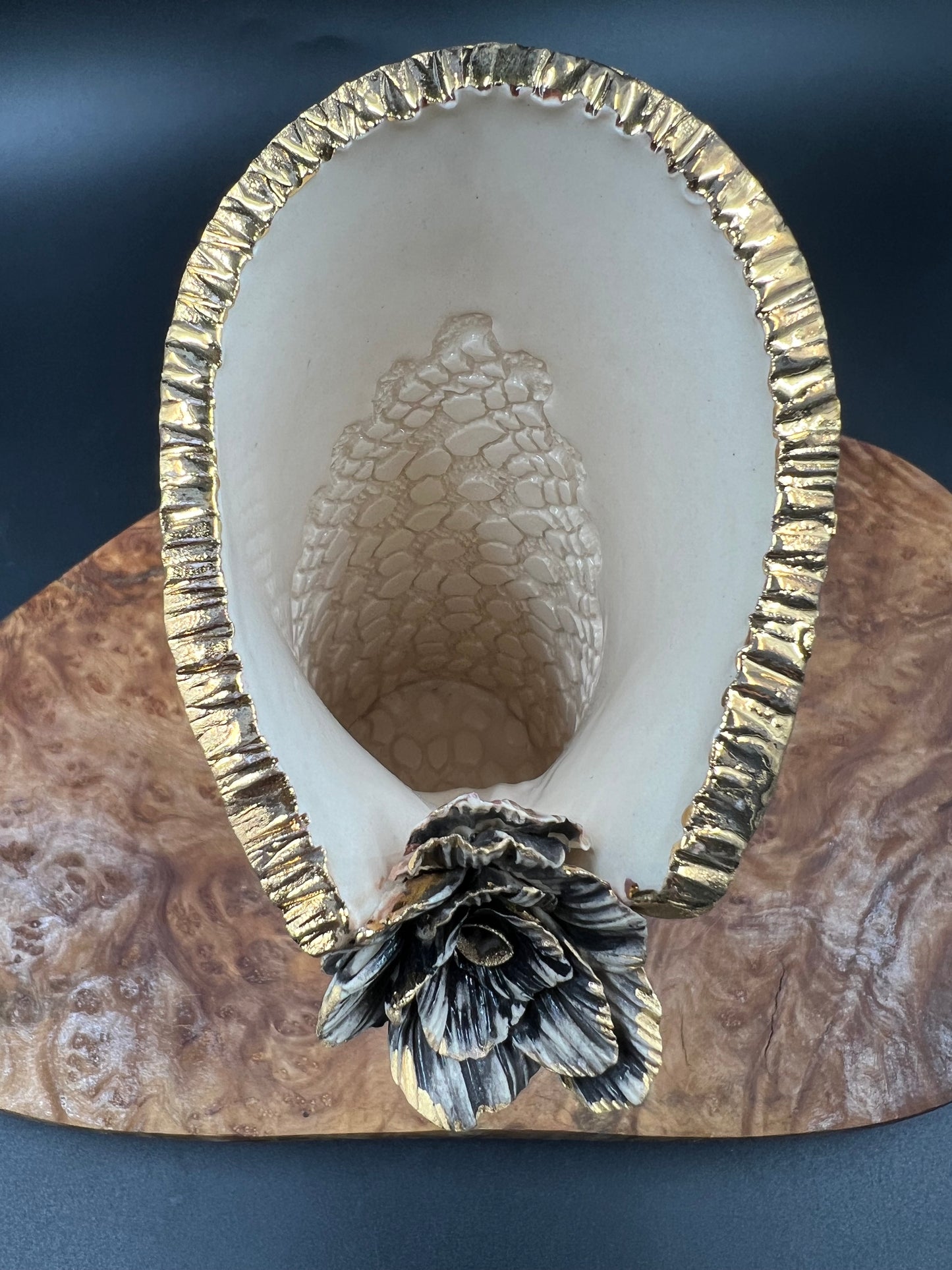 Mini black and gold vase with flower accent
