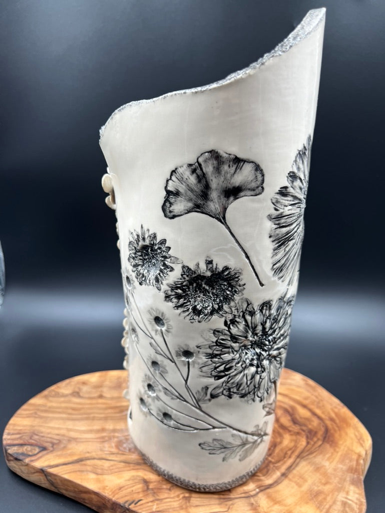 Black floral vase, cascading flowers