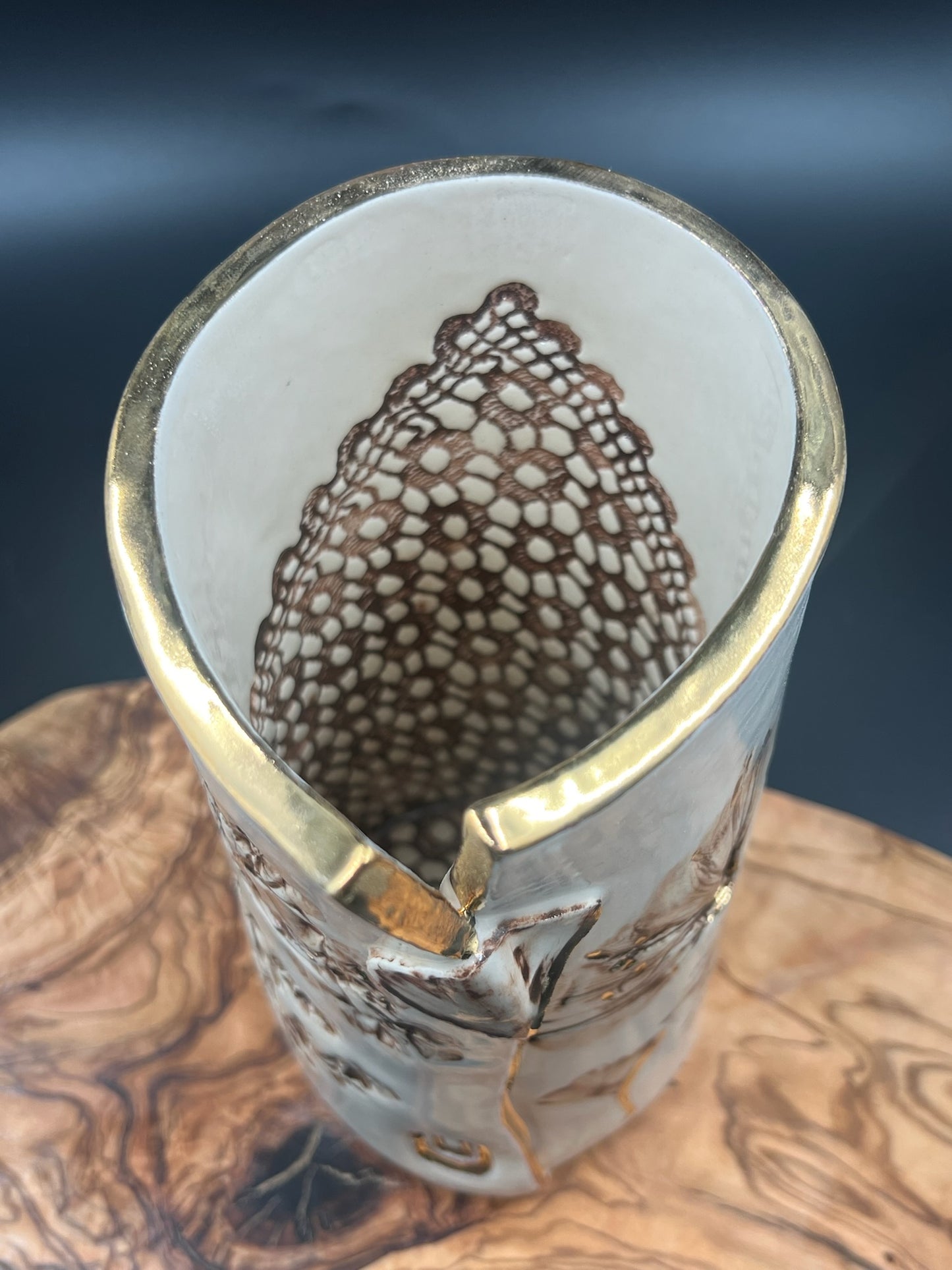 Sepia vase with sepia lace interior and gold rim