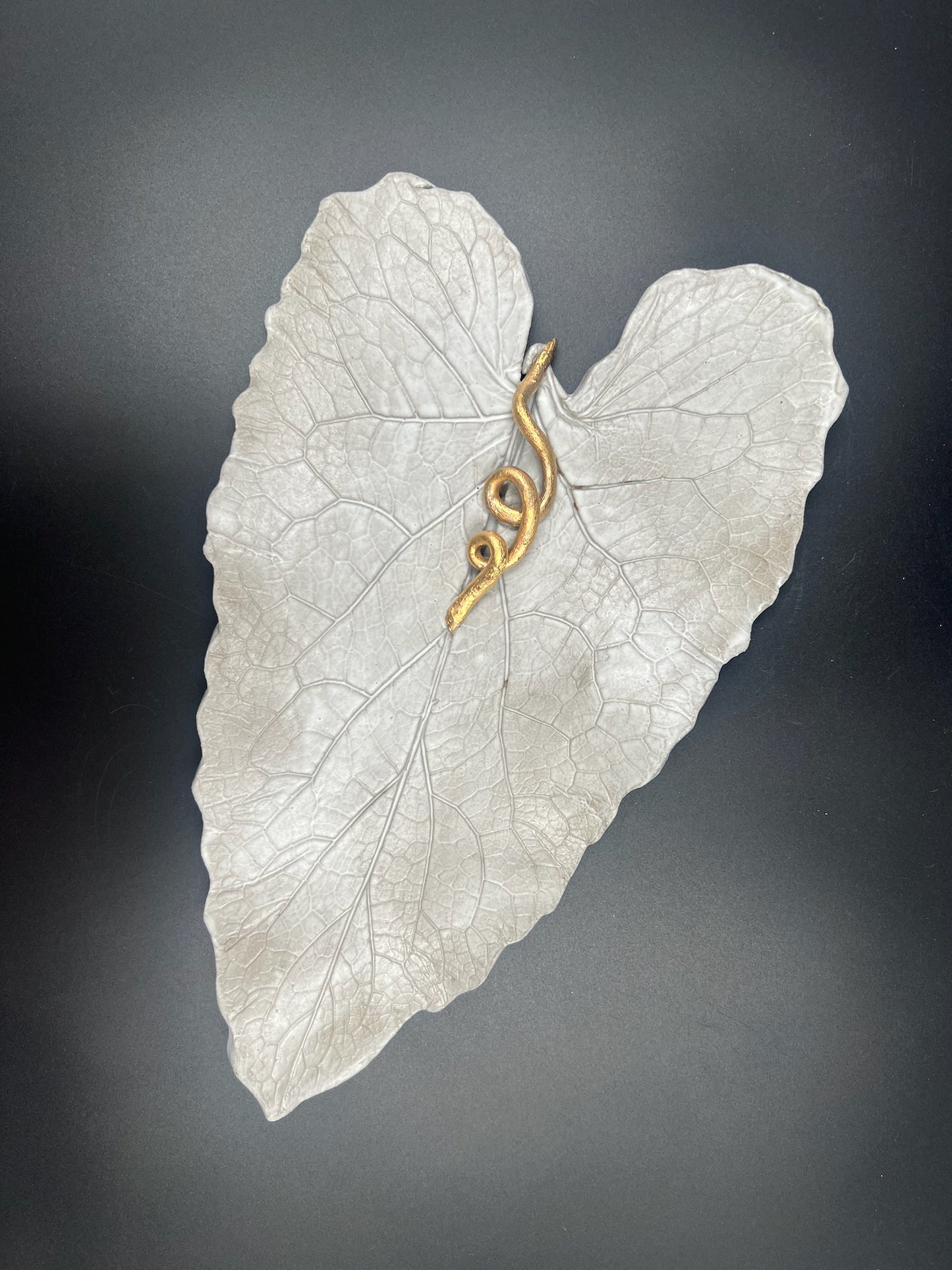 Stone leaf with gold stem