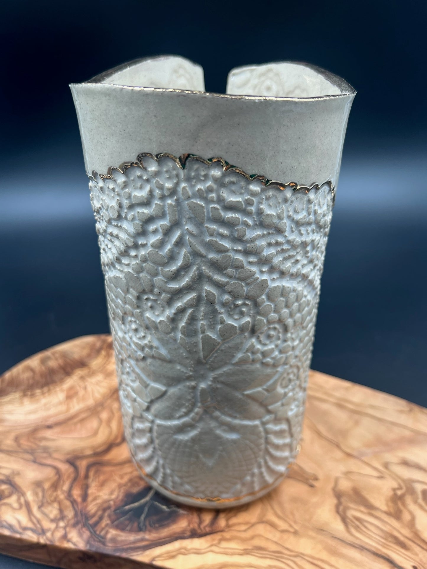 Stone lace vase with gold rim and detail